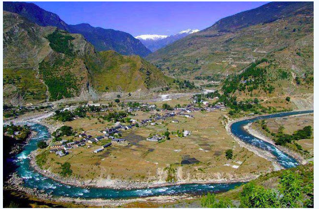 River valley settlement and mountain landscape